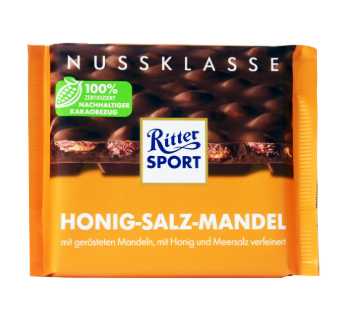 РИТЪР СПОРТ МЛЕЧЕН ШОКОЛАД С ПЕЧЕНИ ОСОЛЕНИ БАДЕМИ ПОКРИТИ С МЕД 100 ГР / ОРАНЖ/ 