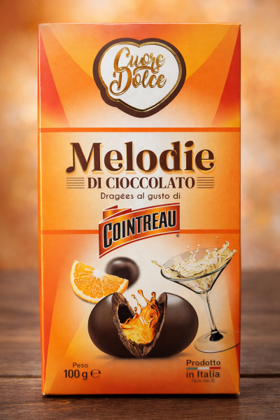 КУОРЕ ДОЛЧЕ ИТАЛИАНСКИ БОНБОНИ С ЧЕРЕН ШОКОЛАД И С КОАНТРО 100 ГР /ОРАНЖ/